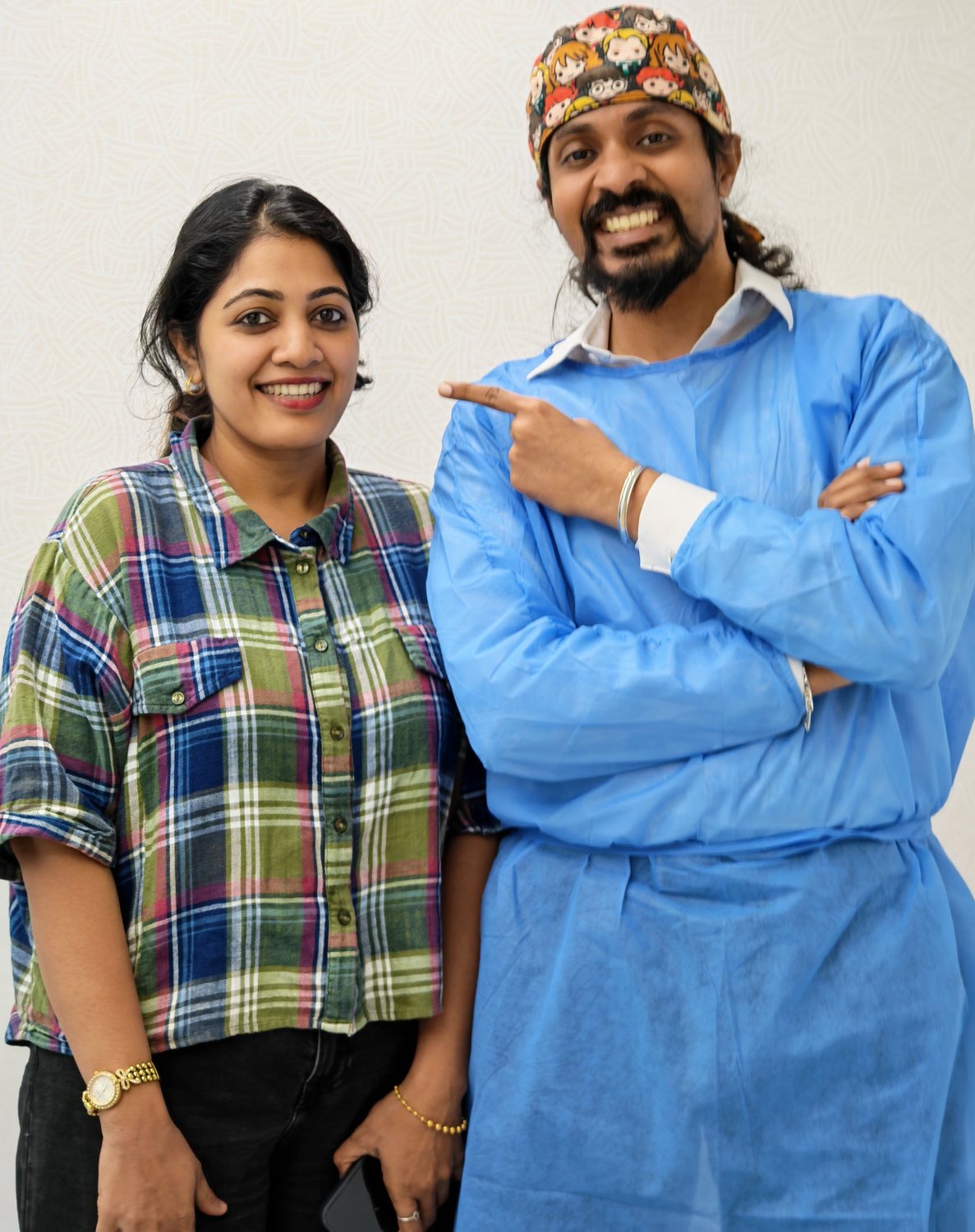 Dr. Keerthan with a patient, sharing a laugh