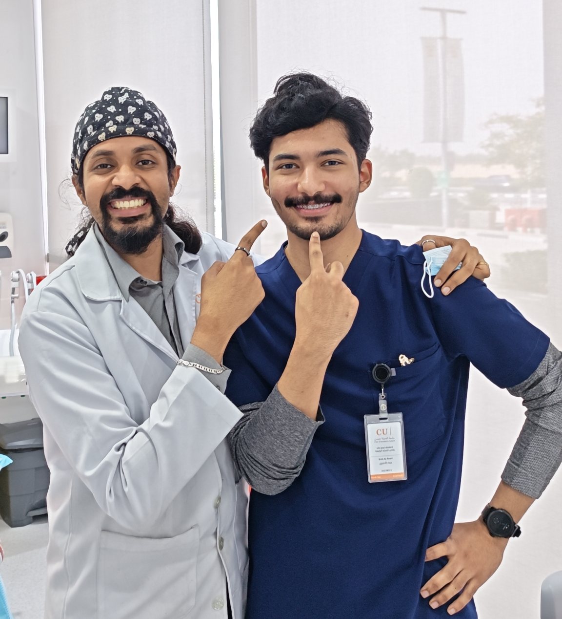 Dr. Keerthan with a colleague at the clinic