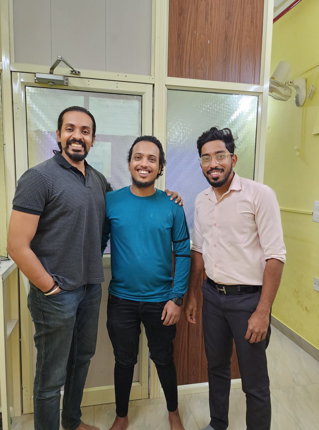 Dr. Keerthan with a patient on their last day of treatment