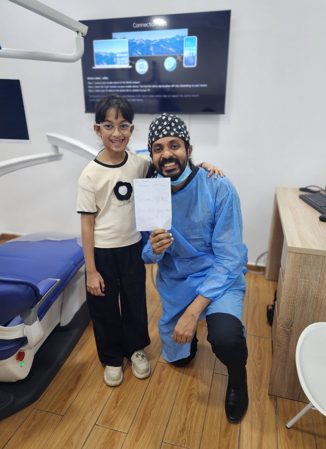 Dr. Keerthan and colleagues with a patient