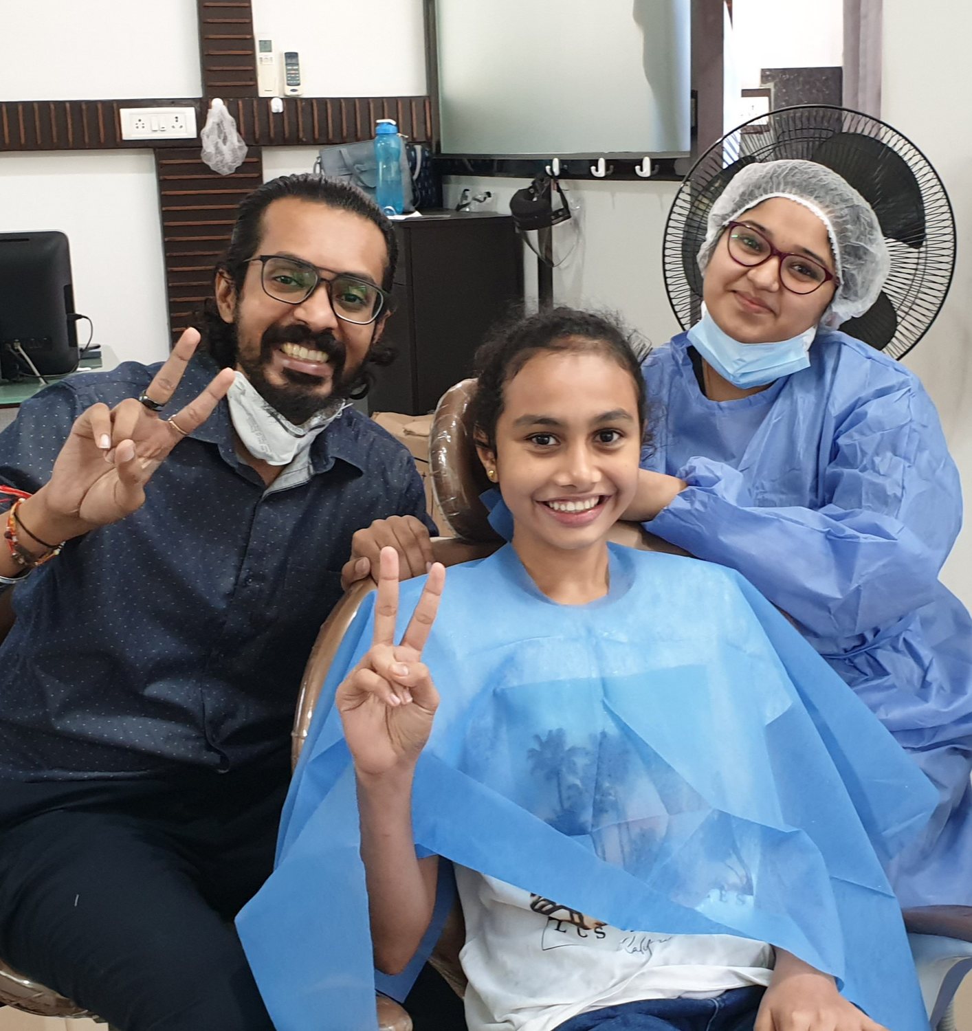 Dr. Keerthan with a patient and a colleague