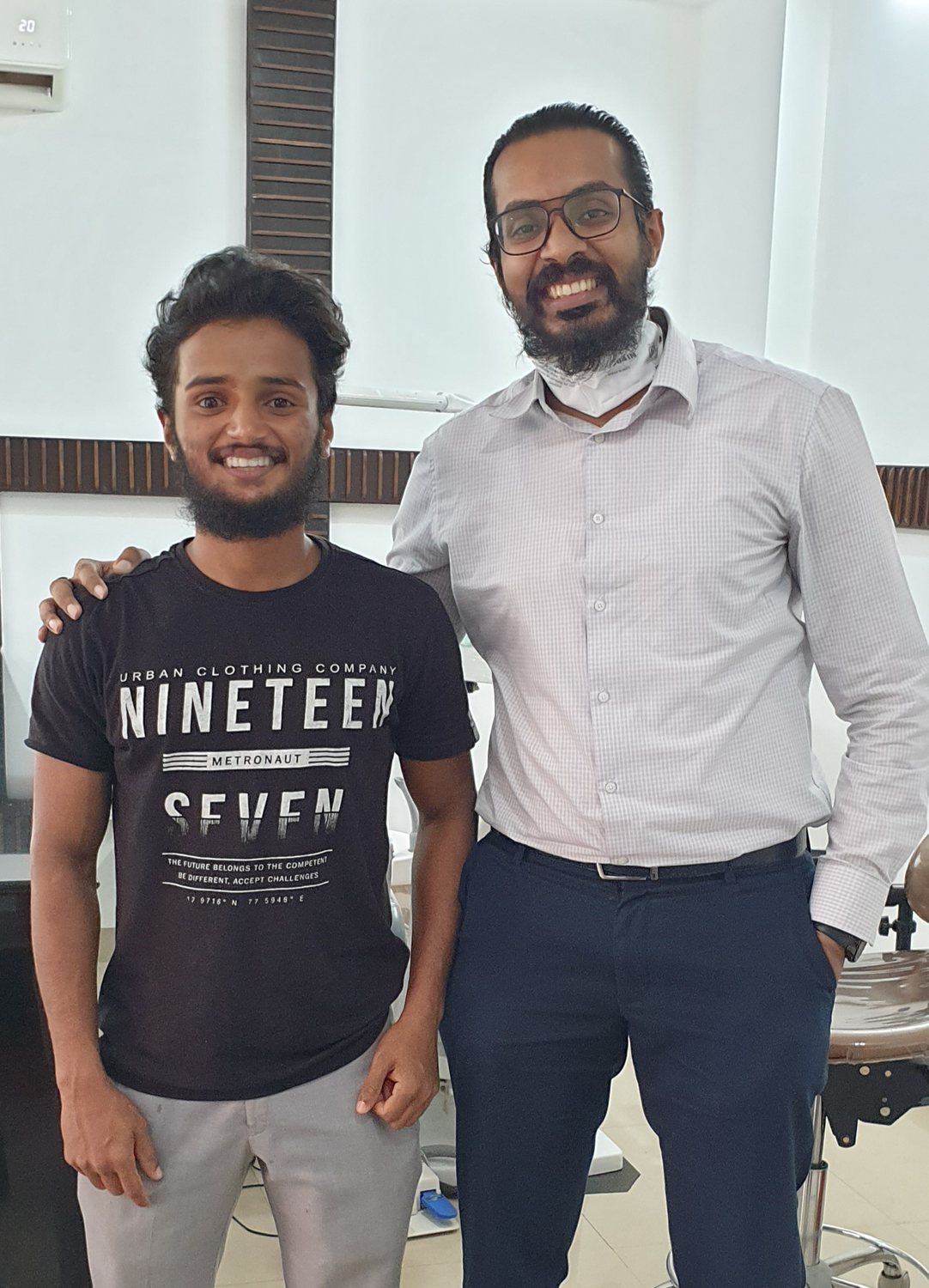 Dr. Keerthan with a patient on their last day of treatment