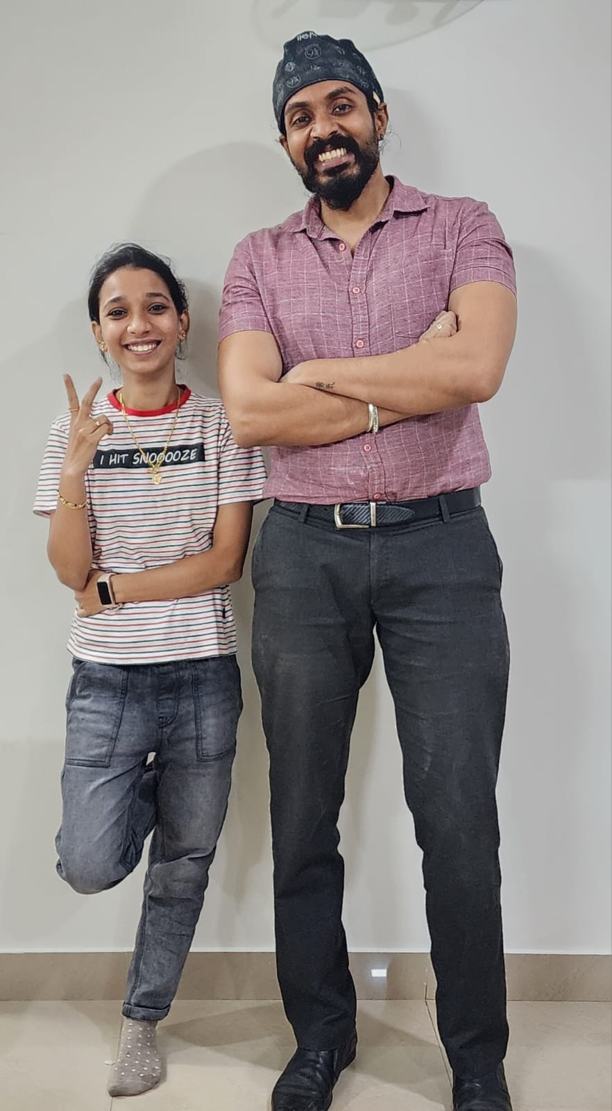 Dr. Keerthan with a patient after she finished orthodontic treatment