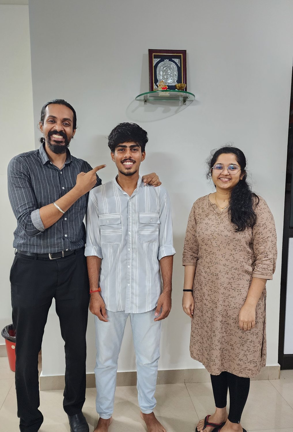 Dr. Keerthan with a patient on their last day of treatment